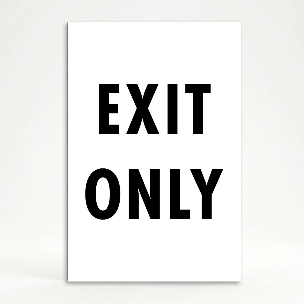 Exit Only sign black and white directional traffic sign