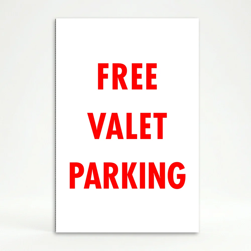 Free Valet Parking sign bold red text on white background