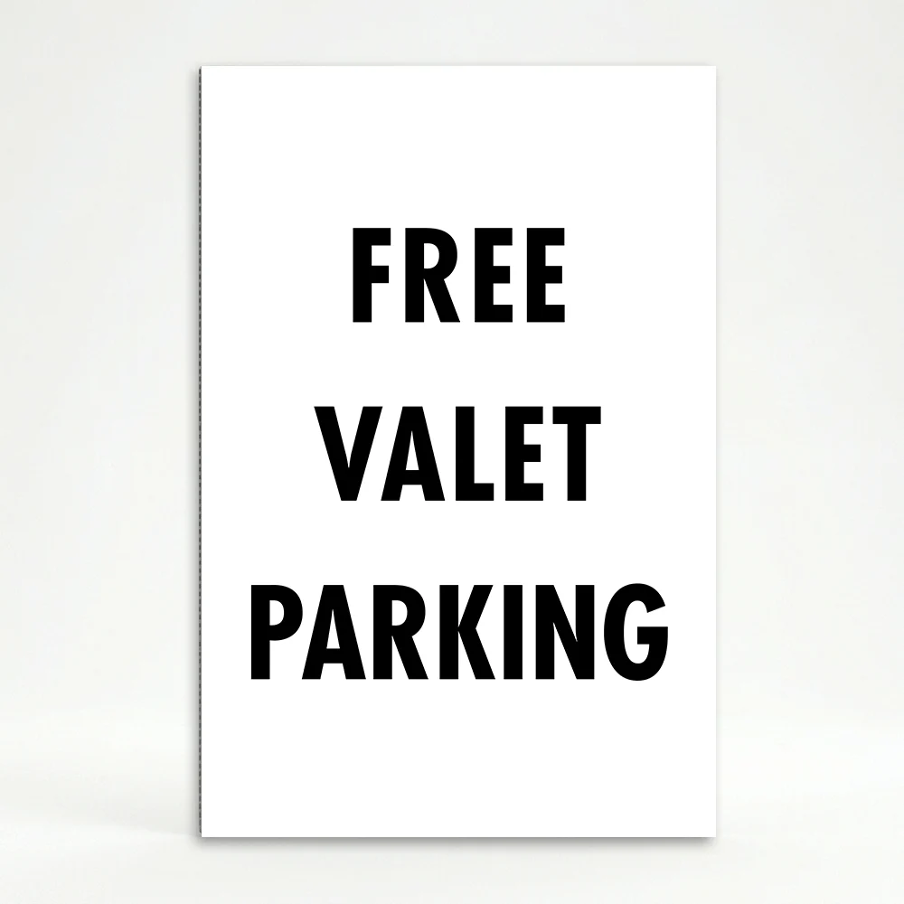 Free Valet Parking sign black text on white background