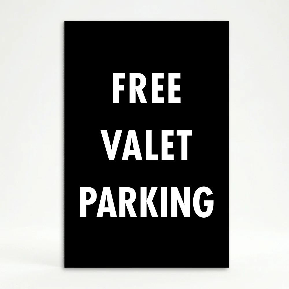 Free Valet Parking sign white text on black background high contrast