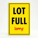 Lot Full Sorry parking sign with yellow background and bold text