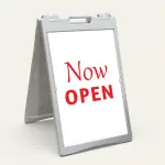 Now Open sign with white background and red text for A-frame display
