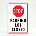Parking Lot Closed sign with red STOP symbol and black text on white background