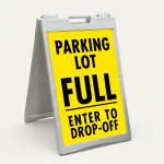 Parking Lot Full Enter to Drop-Off sign with black text on yellow background