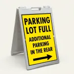 Parking Lot Full Additional Parking in the Rear sign with right arrow on yellow background