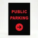Public Parking sign with red text and right-pointing arrow on black background