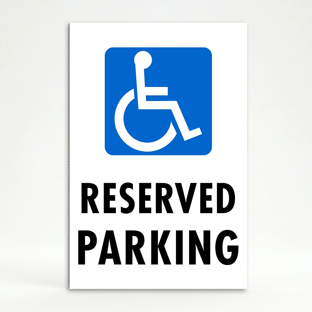 Handicap Reserved Parking sign with blue wheelchair accessibility symbol and black text on white background