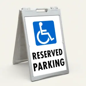 Handicap Reserved Parking sign with blue wheelchair accessibility symbol and black text on white background