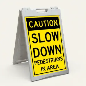 Caution Slow Down Pedestrians in Area sign with yellow and black two-section design