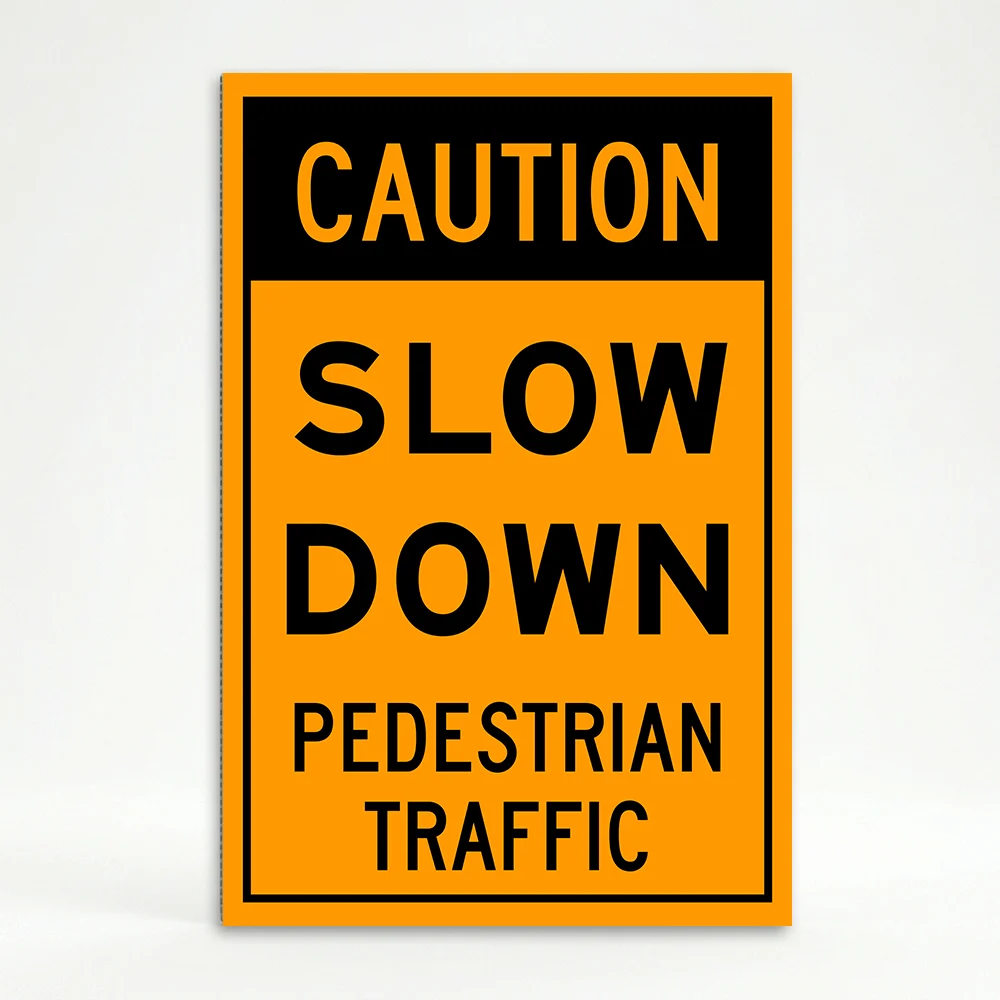 Caution Slow Down Pedestrian Traffic sign with bold black text on orange background