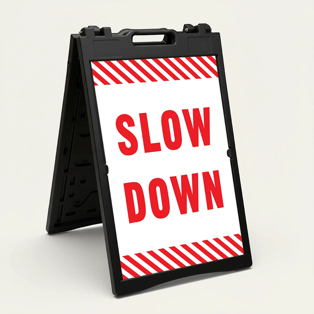 Slow Down sign with red text on white background and diagonal red and white hazard stripes