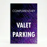 Complimentary Valet Parking sign with white text on purple and black abstract background