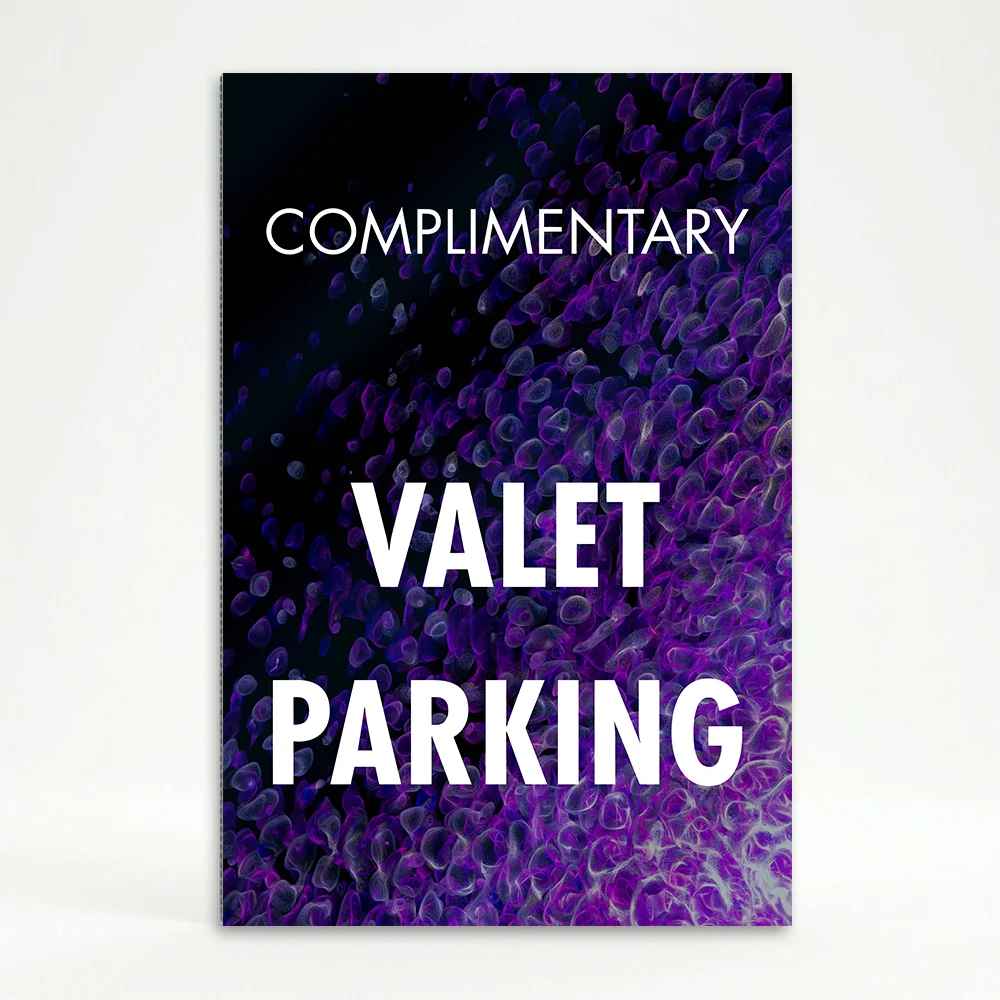 Complimentary Valet Parking sign with white text on purple and black abstract background
