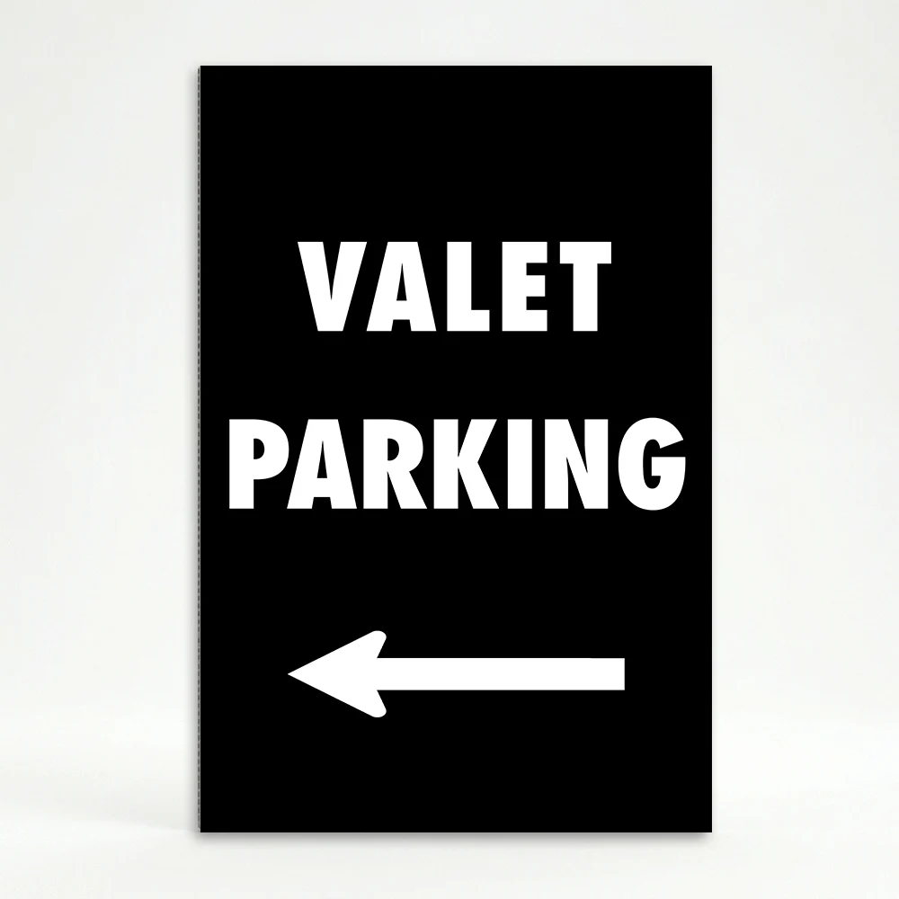 Valet Parking sign with bold white text and left-pointing arrow on black background