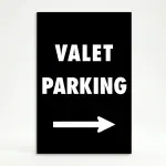 Valet Parking sign with bold white text and right-pointing arrow on black background