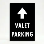 Valet Parking sign with large upward white arrow above bold white text on black background
