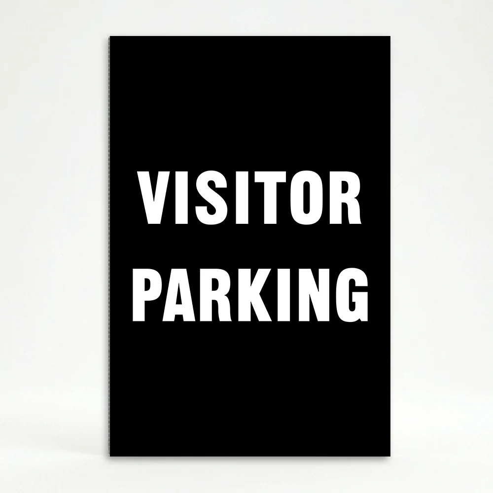 Visitor Parking sign with bold white text on black background