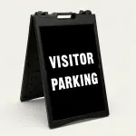 Visitor Parking sign with bold white text on black background
