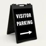 Visitor Parking sign with bold white text and right-pointing arrow on black background
