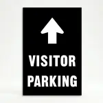 Visitor Parking sign with large upward white arrow above bold white text on black background