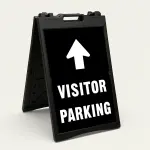 Visitor Parking sign with large upward white arrow above bold white text on black background