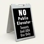 No Public Elevator Tenants and ADA Use Only sign with bold white text on black background