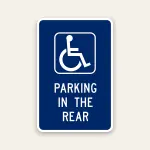 Handicap parking in the rear sign with ADA symbol directing drivers to rear parking area