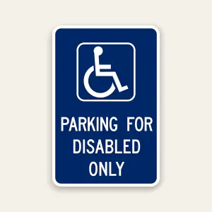Parking for disabled only sign with ADA symbol indicating reserved accessible parking
