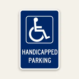 Handicapped parking sign with ADA symbol indicating designated accessible parking area
