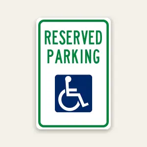 Reserved handicap parking sign with ADA symbol marking designated accessible space