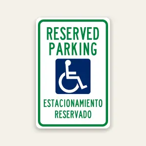 Reserved handicap parking bilingual sign with ADA symbol and Spanish English text