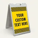 Custom text hazard stripe A-frame sign with yellow panel and black diagonal stripes in white frame for Los Angeles business or construction site