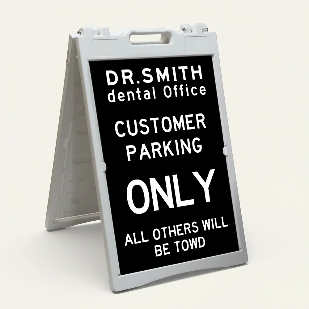 Custom tow warning parking enforcement A-frame sign with black background and white text for Los Angeles retail store apartment or office building