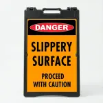 Custom OSHA style danger safety A-frame sign with red danger badge and orange background for Los Angeles construction site or industrial facility