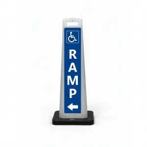 Blue and white handicap accessible ramp flat cone sign with wheelchair symbol vertical RAMP lettering and left arrow for directional guidance in Los Angeles building entrance or parking structure