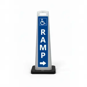Blue and white handicap accessible ramp flat cone sign with wheelchair symbol vertical RAMP lettering and right arrow for directional guidance in Los Angeles building entrance or parking structure