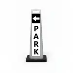 Black and white park here flat cone sign with white left arrow on black header and vertical PARK lettering on white panel for Los Angeles parking lot garage or shopping center