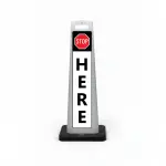 Black white and red stop here flat cone sign with STOP symbol on black header and vertical HERE lettering on white background for Los Angeles valet drop-off ticket booth or security checkpoint