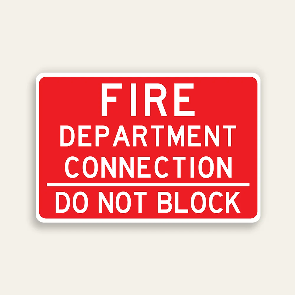 Full red 18x12 horizontal Maxmetal sign with bold white FIRE DEPARTMENT CONNECTION text across three lines in upper zone, white horizontal dividing line, and bold white DO NOT BLOCK text in lower zone, no border.