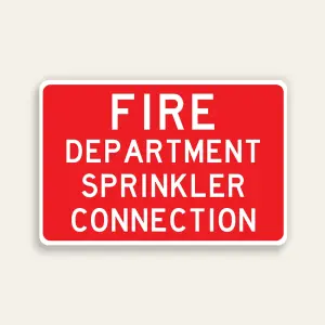 Full red 18x12 horizontal Maxmetal sign with bold white FIRE DEPARTMENT SPRINKLER CONNECTION text across four lines filling the red panel, no border.
