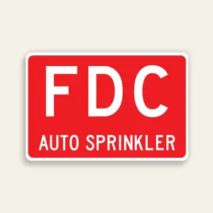 Full red 18x12 horizontal Maxmetal sign with large bold white FDC letters in upper zone and smaller white AUTO SPRINKLER text in lower zone on red panel, no border.