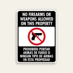 Full black 18x24 vertical Maxmetal sign with bold white English text No Firearms Or Weapons Allowed On This Property at top, white-bordered inset with red circle-slash over handgun icon in center, and Spanish text Prohibido Portar Armas De Fuego O Ningún Tipo De Armas En Esta Propiedad in white at bottom.
