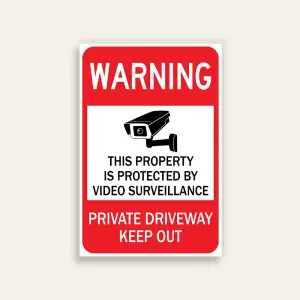 Full red 12x18 vertical Maxmetal sign with bold white WARNING header, white-bordered inset panel with CCTV camera illustration and black text This Property Is Protected By Video Surveillance, and bold white PRIVATE DRIVEWAY KEEP OUT text on red lower panel.