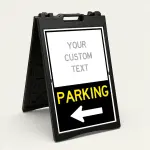 Custom directional parking A-frame sign with white upper branding section and black lower parking direction panel with yellow text and white arrow for Los Angeles venue or business
