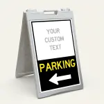 Custom directional parking A-frame sign with white upper branding section and black lower parking direction panel with yellow text and white arrow for Los Angeles venue or business