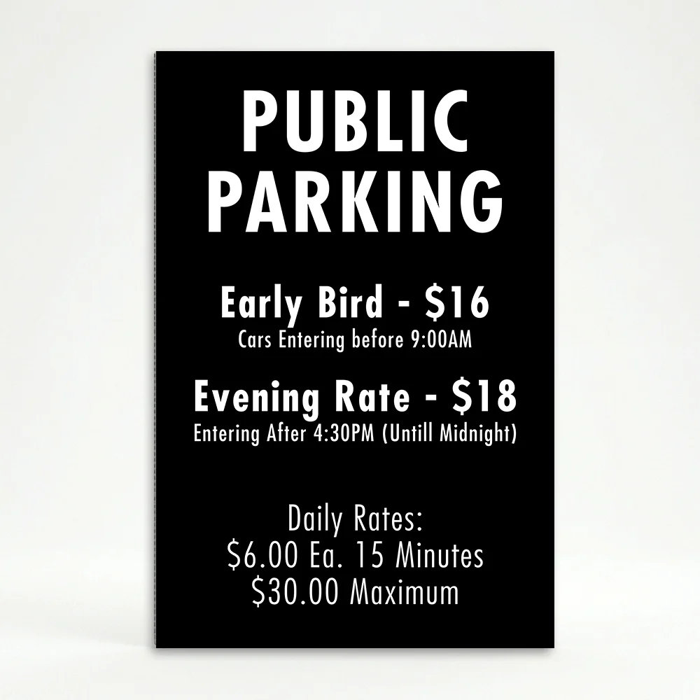 Custom multi-rate parking schedule A-frame sign with white text on black panel showing early bird rate, evening rate, and daily interval rate for Los Angeles parking lot