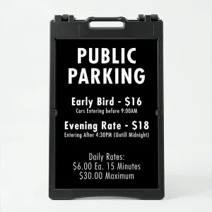 Custom multi-rate parking schedule A-frame sign with white text on black panel showing early bird rate, evening rate, and daily interval rate for Los Angeles parking lot