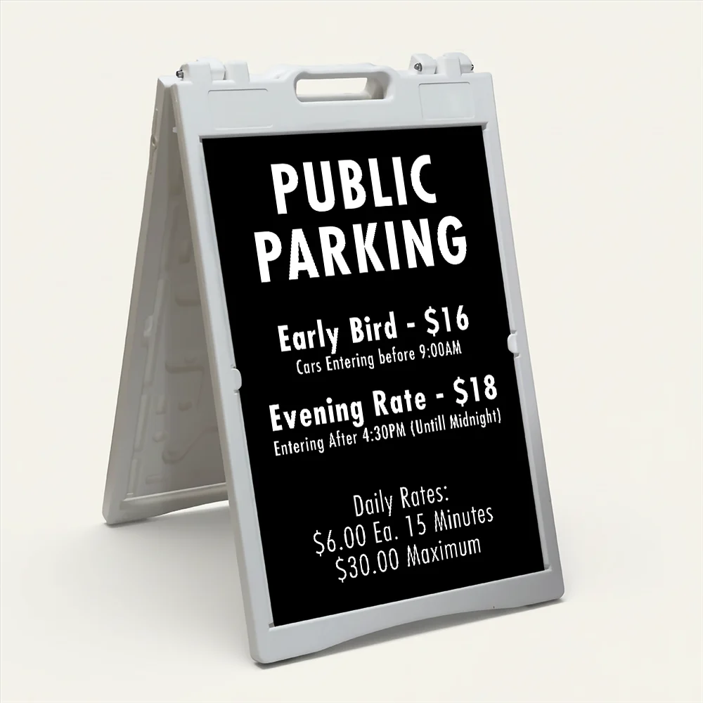 Custom multi-rate parking schedule A-frame sign with white text on black panel showing early bird rate, evening rate, and daily interval rate for Los Angeles parking lot