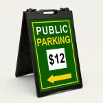Custom green and yellow parking rate directional A-frame sign with white rate display box and yellow arrow for Los Angeles parking lot or event venue