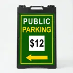 Custom green and yellow parking rate directional A-frame sign with white rate display box and yellow arrow for Los Angeles parking lot or event venue